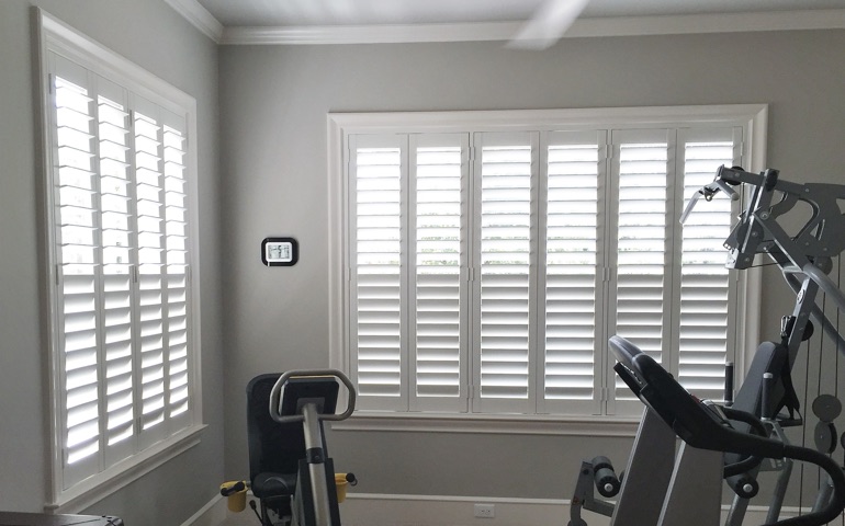 Southern California exercise room with shuttered windows.